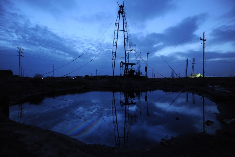Oil rigs dominate the skyline at an oil field outside the Azerbaijan's capital, Baku.